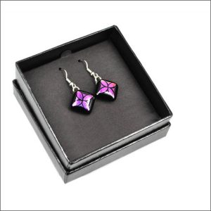Purple glass earrings with tapa design